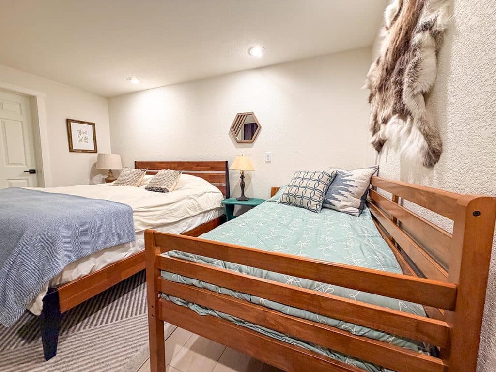 Boom Chalet primary bedroom with king bed and twin daybed